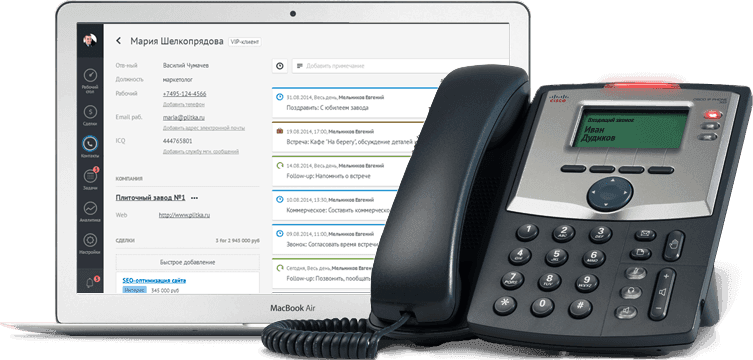 Телефон, подключённый к CRM-системе на ноутбуке. Офисная телефония
